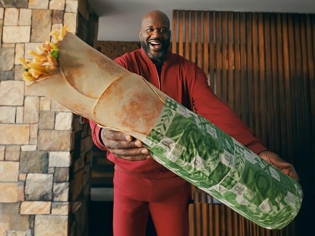 Shaquille O'Neal, a basketball legend, is making a big splash in Abu Dhabi's street food scene with Shaqwarma.