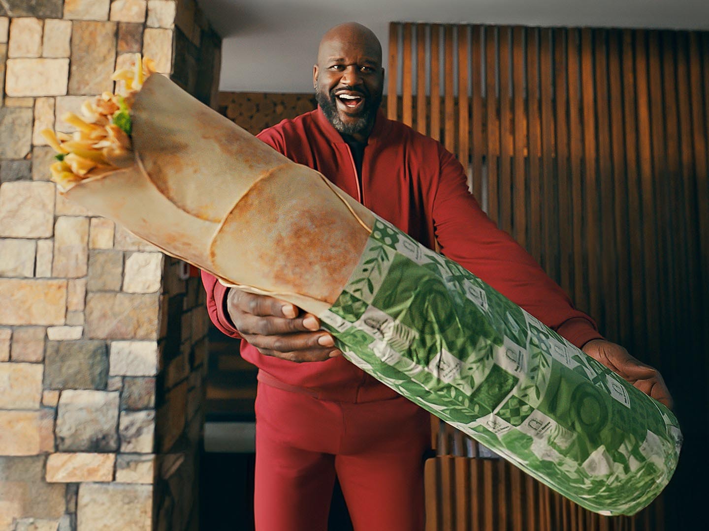 Shaquille O'Neal, a basketball legend, is making a big splash in Abu Dhabi's street food scene with Shaqwarma.